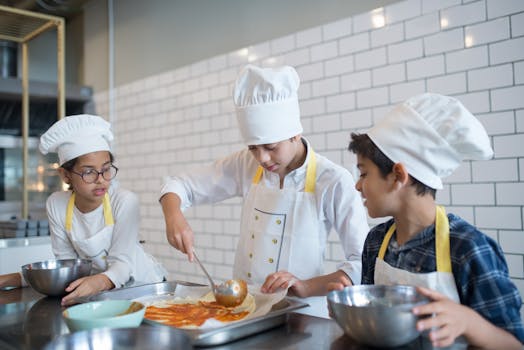 kids making pizzas