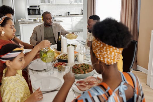 A happy family having dinner together with a variety of healthy foods