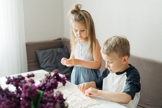 Kids making yogurt parfaits in the kitchen