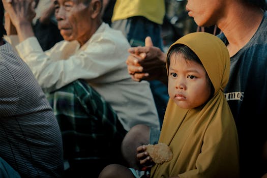 thoughtful child with a snack